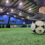 Foot on Soccer ball In Centrefield Sports and Pro Function Sports Injury Clinic